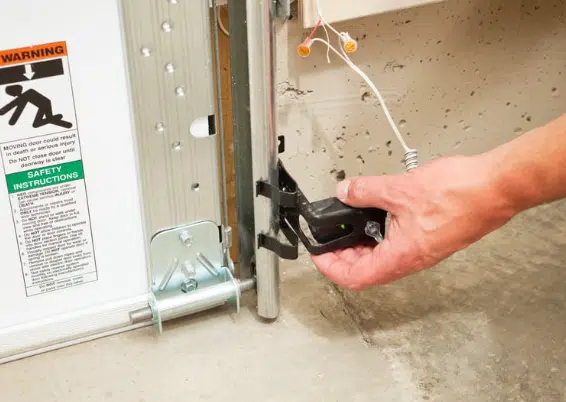 Cleaning garage door sensor