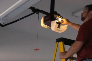 person repairing a garage door