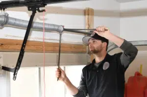person repairing a garage door
